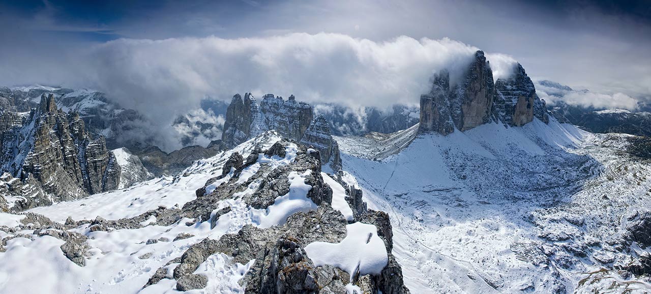 Aerial view of the snowy Tre Cime di Lavaredo of the Alta Pusteria part of the Dolomites