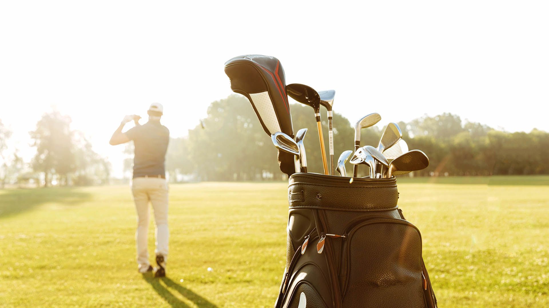 Golfer in action on a green, with close-up of a golf bag.