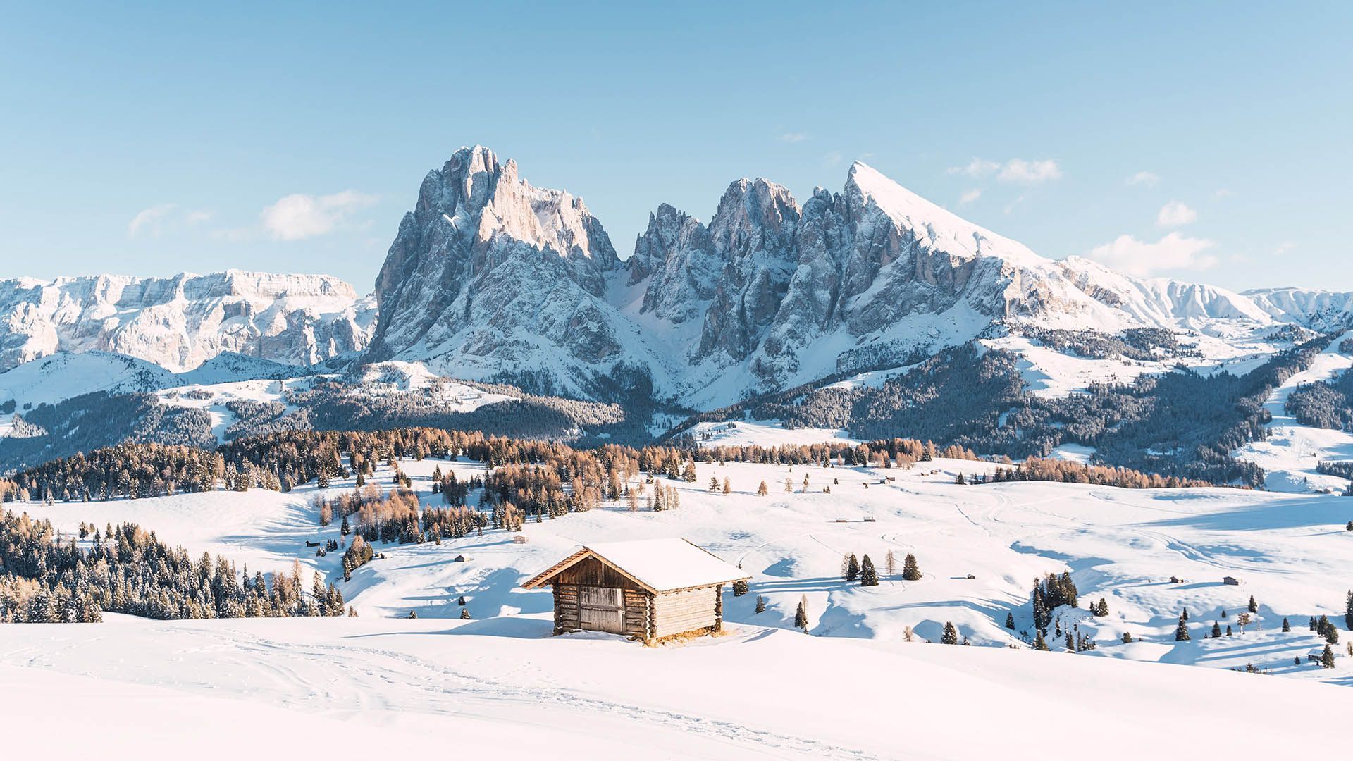 Panoramic view with snow and snow-capped mountains.