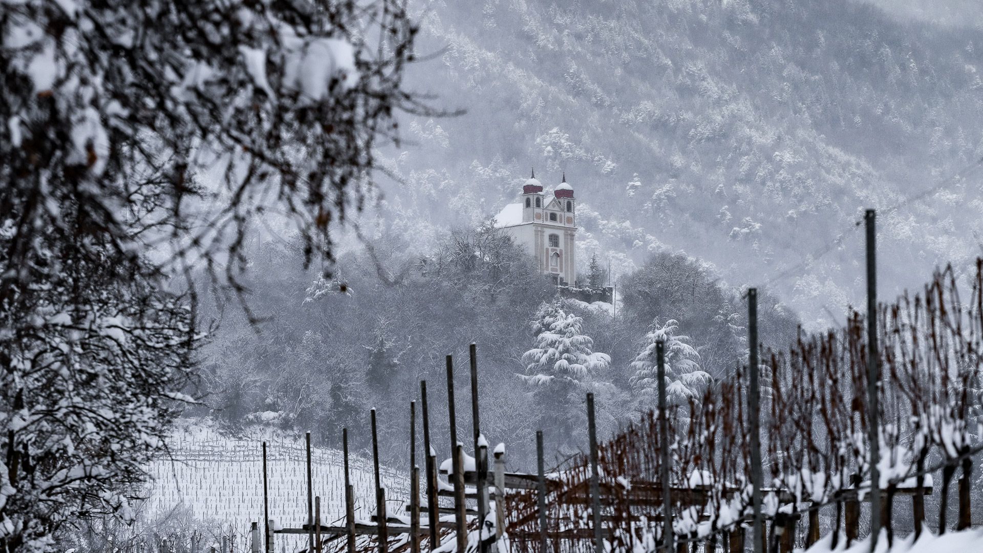 Baroque bell tower in Appiano under the sun