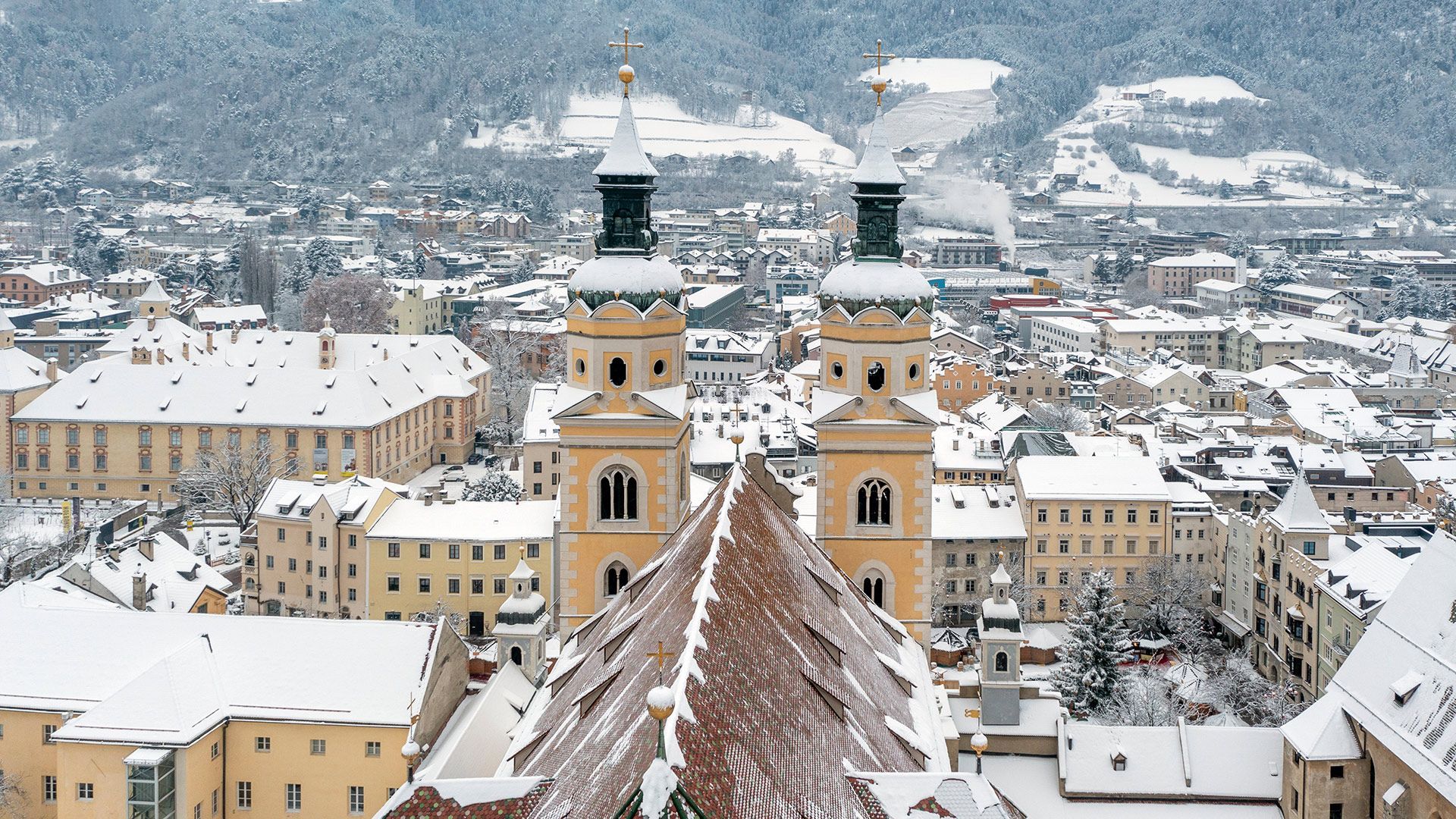 Bressanone Cathedral with twin towers and Baroque façade, seen from the square